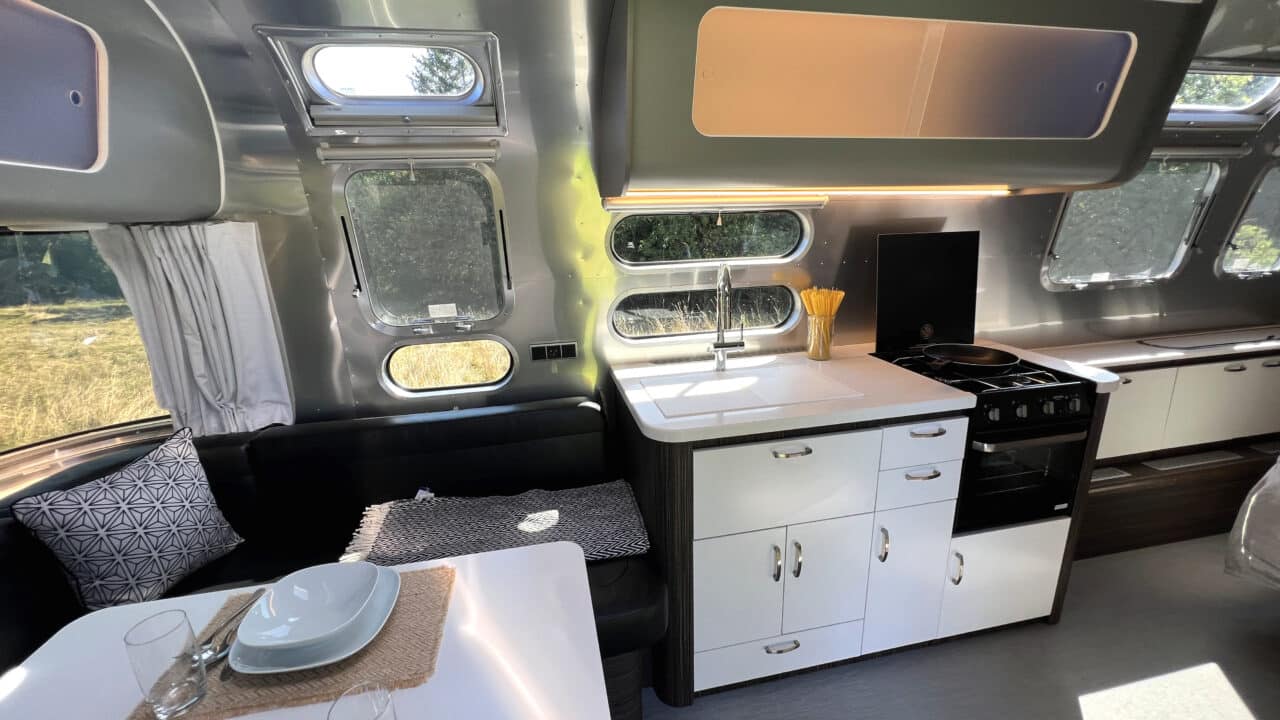 Innovations at Caravan Salon 2023: Airstream Germany presents luxury caravan with comfort bathroom and kitchen with oven 4 Airstream International 25IB Kitchen