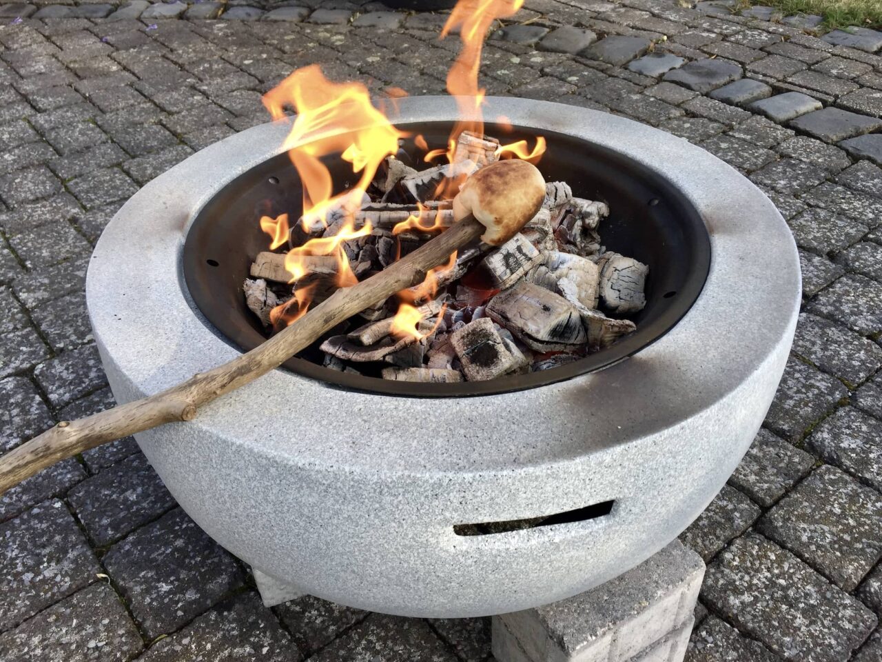 Stick bread as a children's activity in the evening when camping