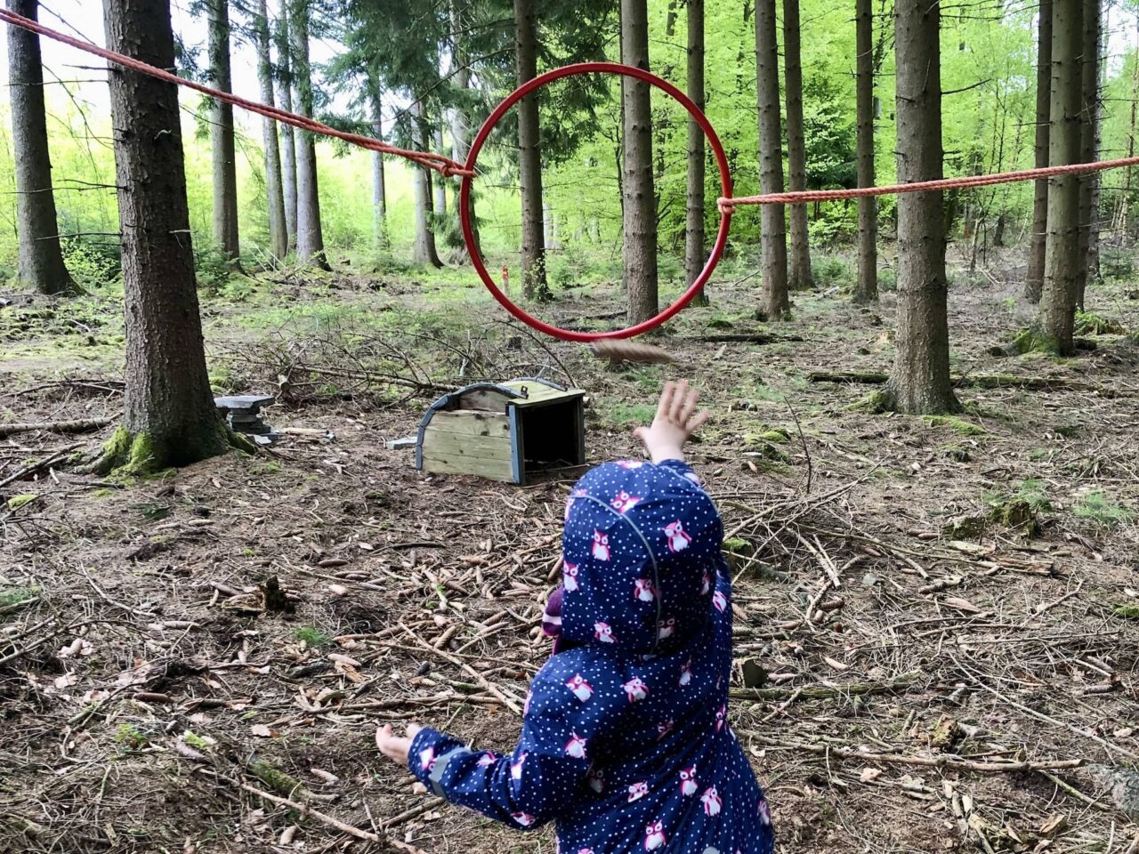 Throwing pine cones as an outdoor children's game